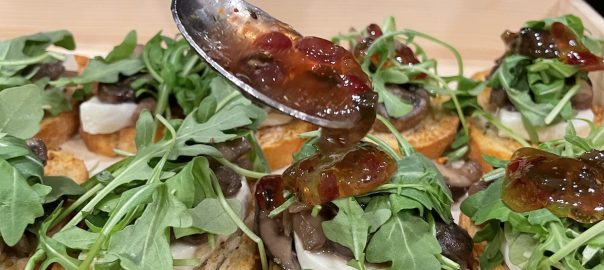 Mushroom Mozzarella arugula Crostini with Onion Raspberry Glaze